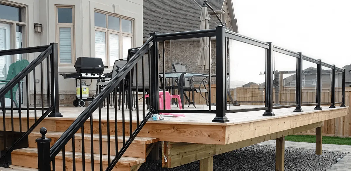 Handrail installation on a deck staircase for safety and code compliance in Springfield, MO