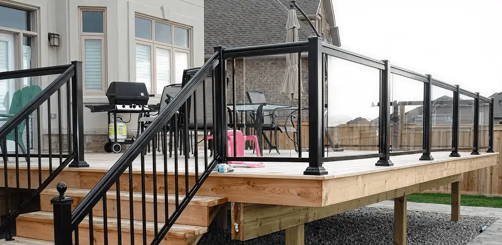 Handrail installation on a deck staircase for safety and code compliance in Springfield, MO