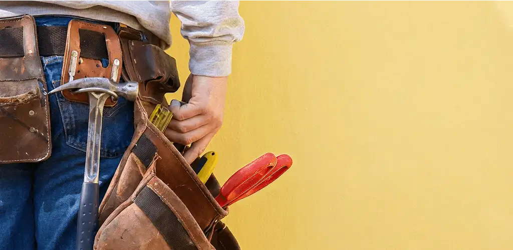 Handyman with tool belt ready for home repairs and maintenance in Springfield, MO